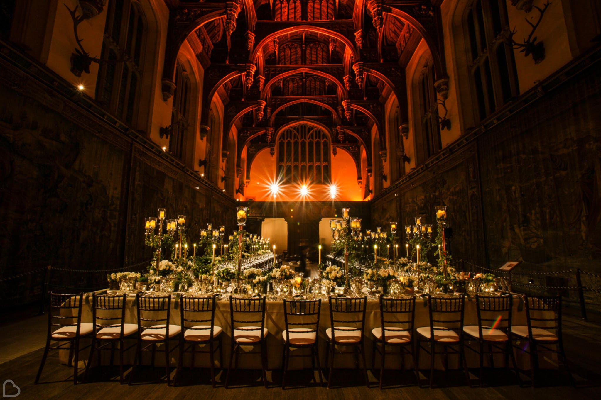 the opulent  hampton court house, darkly lit for a wedding