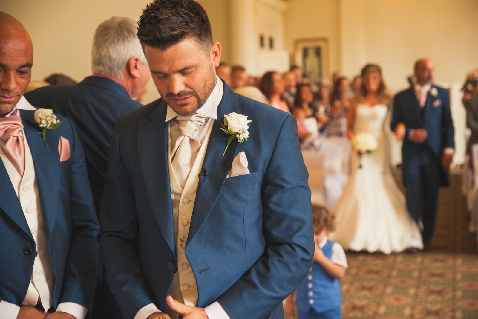 bridebook.co.uk man waiting at the top of the aisle for bride