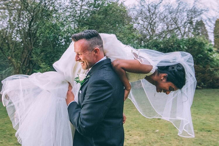 bridebook.co.uk groom picks up bride