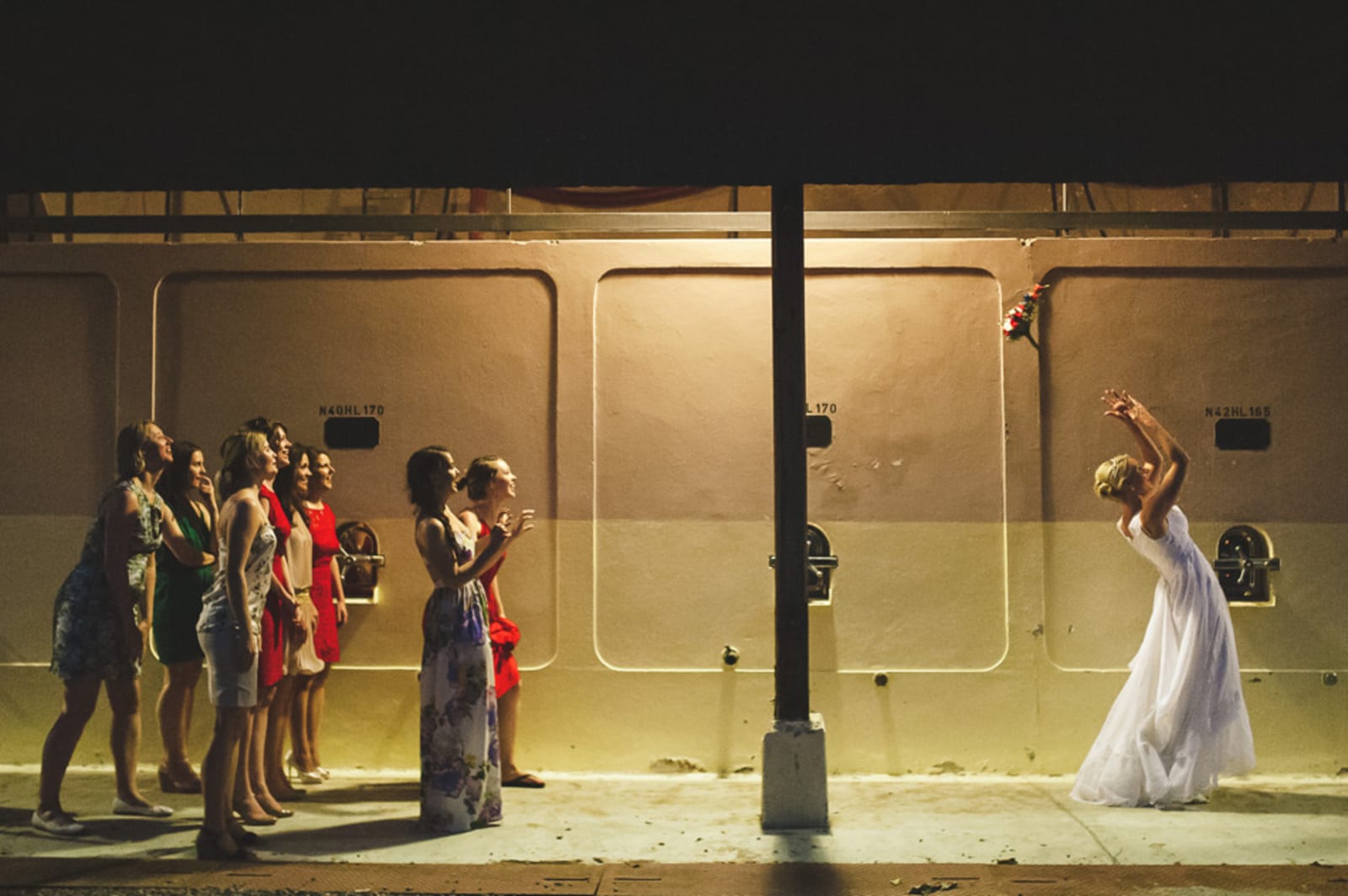 Bridebook.co.uk- bride tossing her wedding bouquet