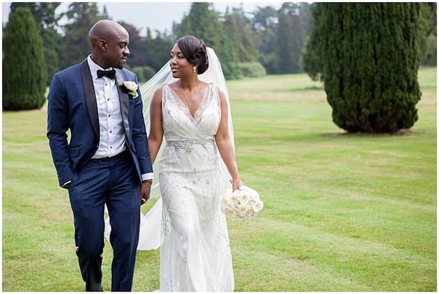 Bridebook.co.uk bride and groom walking hand in hand