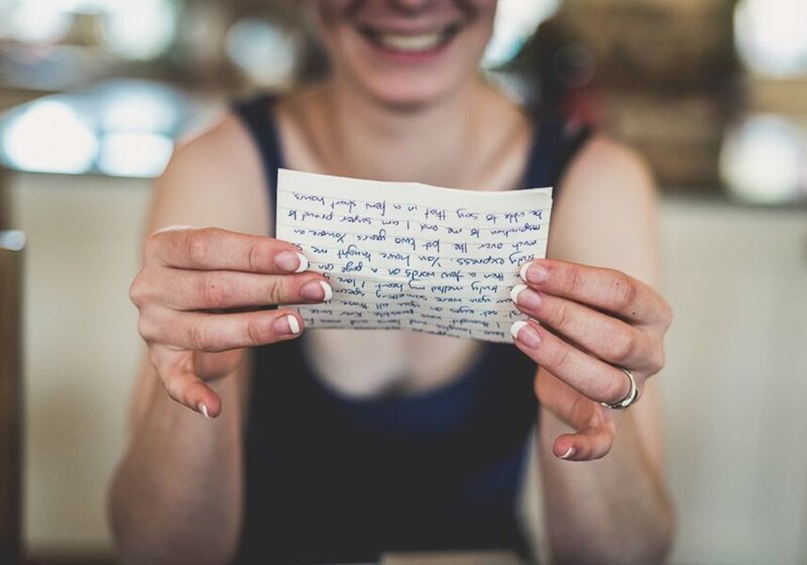 Bridebook.co.uk- bridesmaid reading from a piece of paper