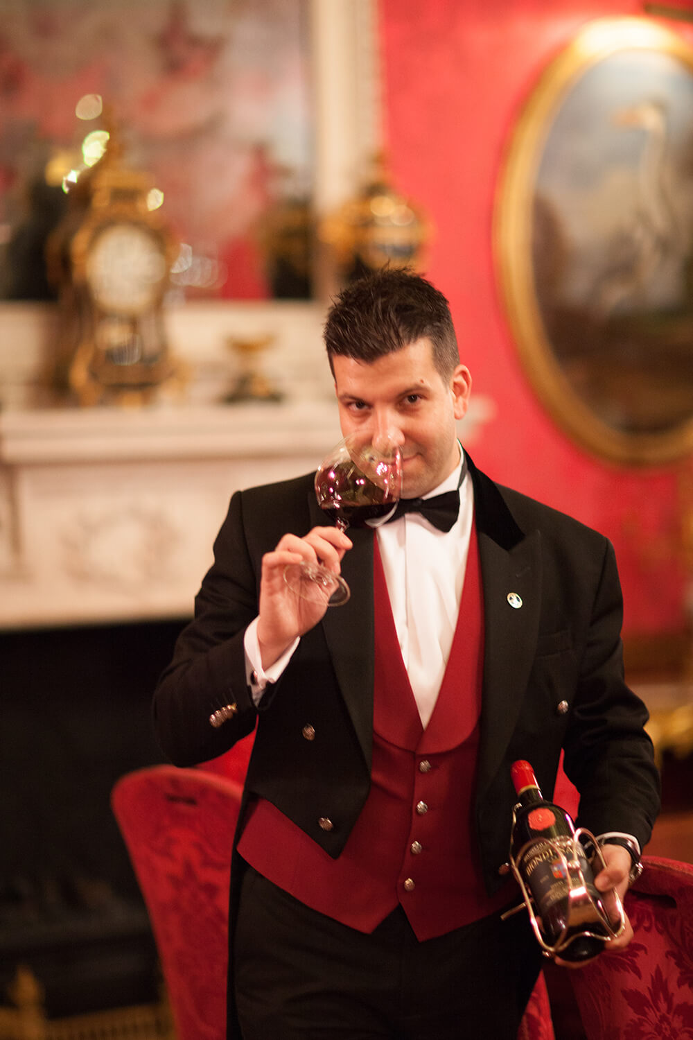 bridebook.co.uk ritz sommelier smelling red wine