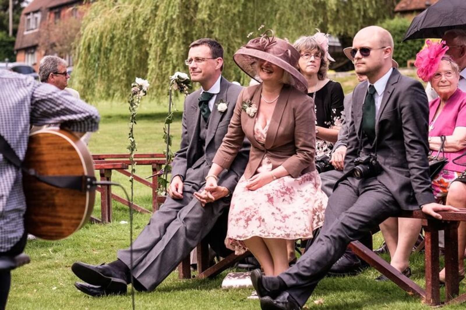 Bridebook.co.uk- guests sitting listening to wedding readings