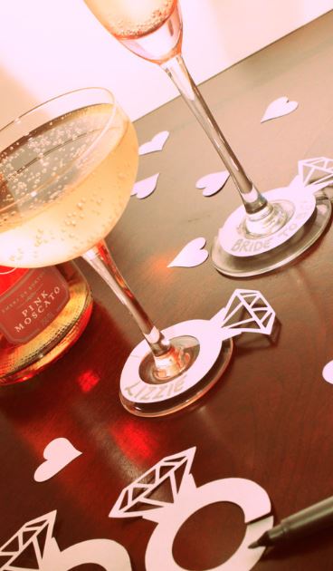 Bridebook.co.uk- champagne glasses with paper engagement rings