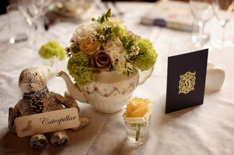 Bridebook.co.uk- place card and wedding invitation on table with flower