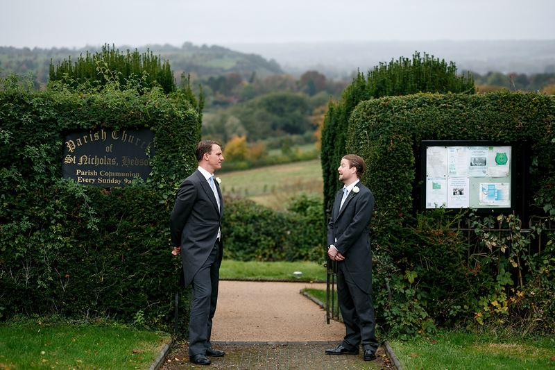 Bridebook.co.uk- groom and ushers waiting to greet guests