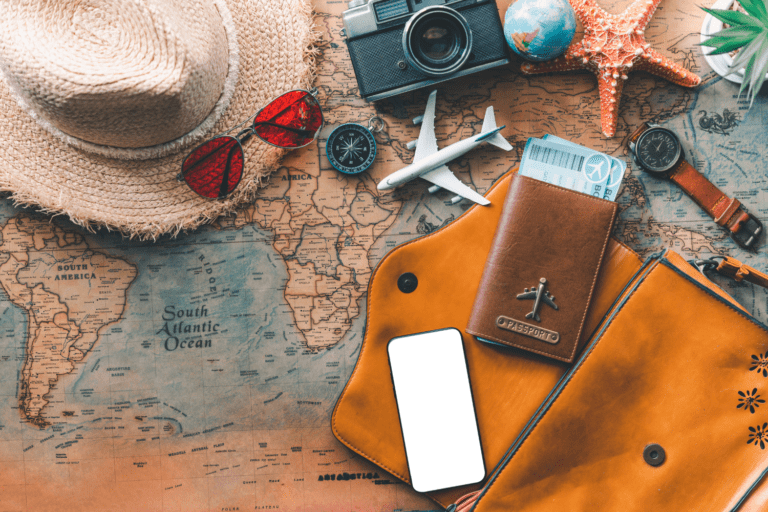 Map with travel items including sunglasses and hat