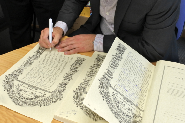 Traditional Jewish wedding signing the ketubah