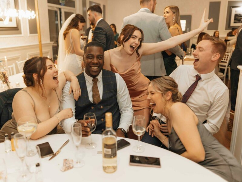 Group of guests having fun at a wedding reception