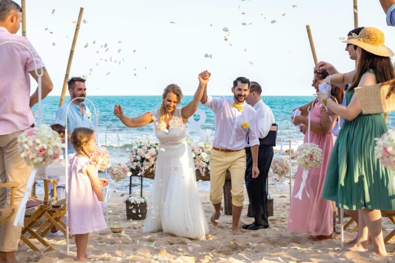 Married couples on a beach with guests
