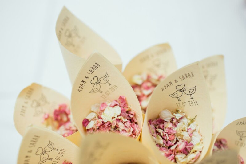 Flower bouquets in printed paper cones