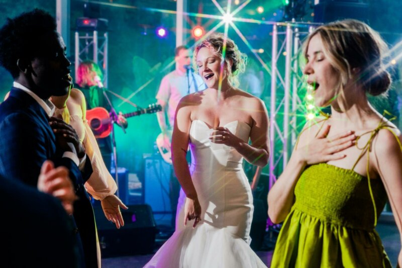 Bride and guests dancing at a wedding reception