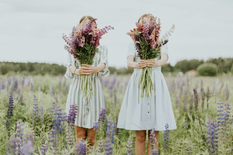 Two girls with big flower bouquets