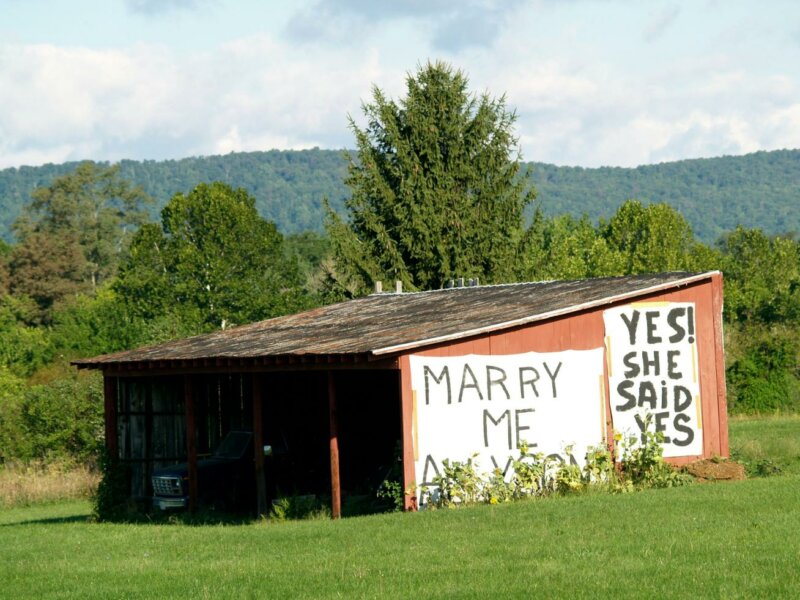 Marry Me and Yes she said yes on a barn