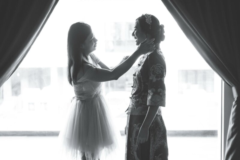 Bride and sister getting ready