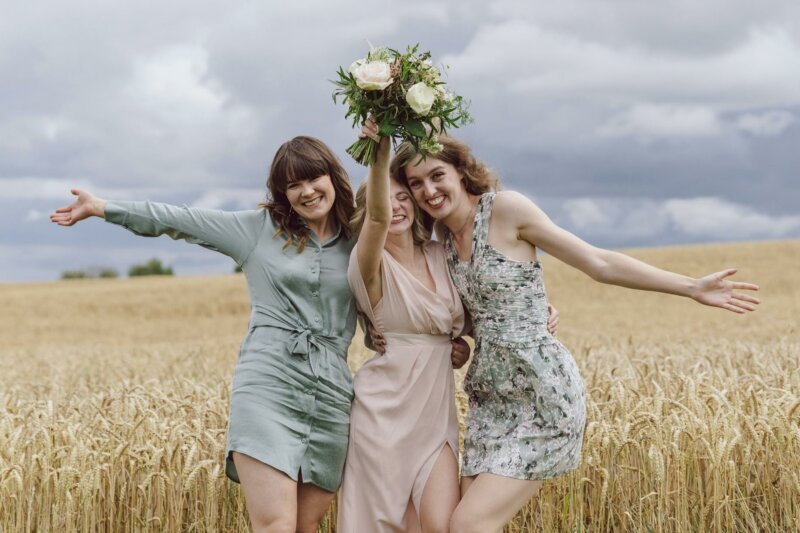Bride and bridesmaids in a field