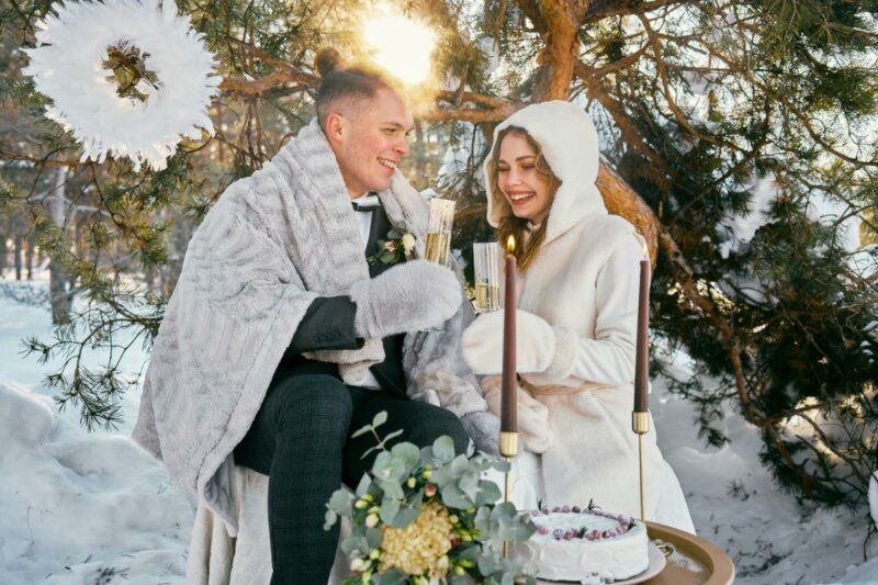 Married couple toasting in a winter setting