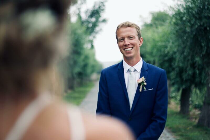 Smiling groom in a suit