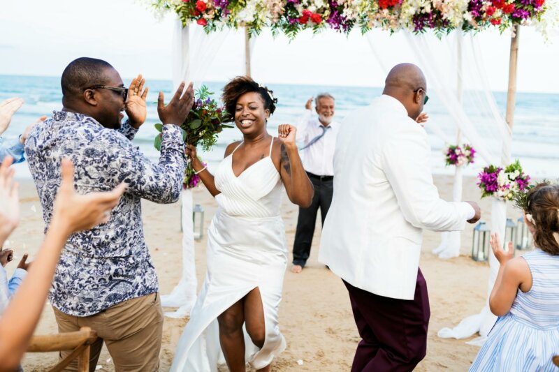 Bride dancing on a beach