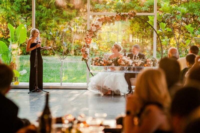 Lady giving a speech at a wedding
