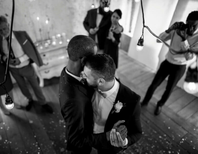 Two grooms dancing