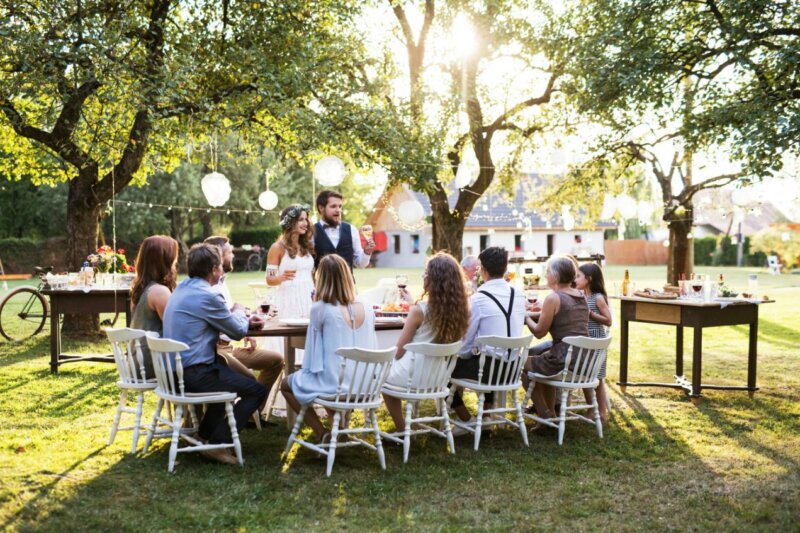 Couple giving a speech at an outdoor wedding