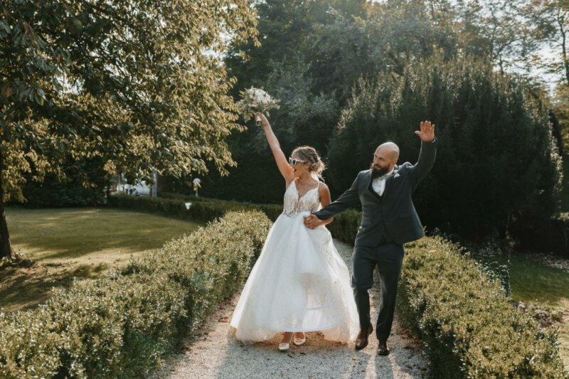 Married couple walking in a garden