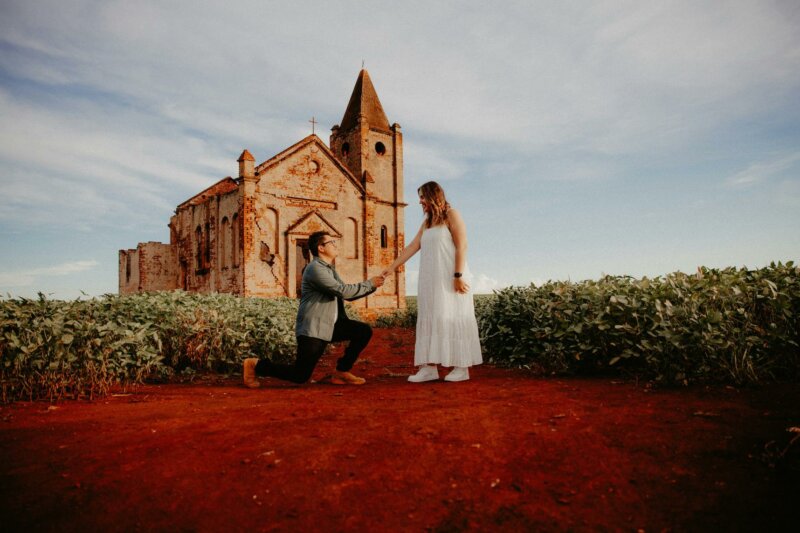 Couple posing in front of a church