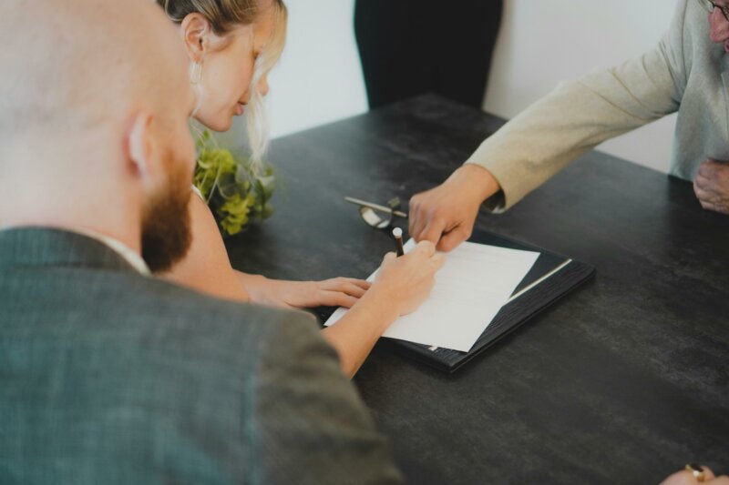 Bride signing at a registry office