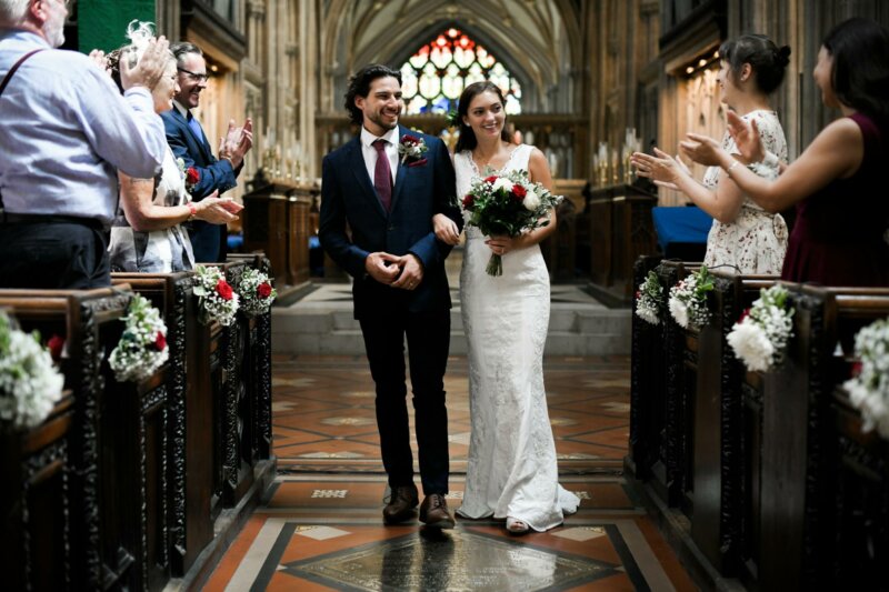 Married couple walking down the aisle