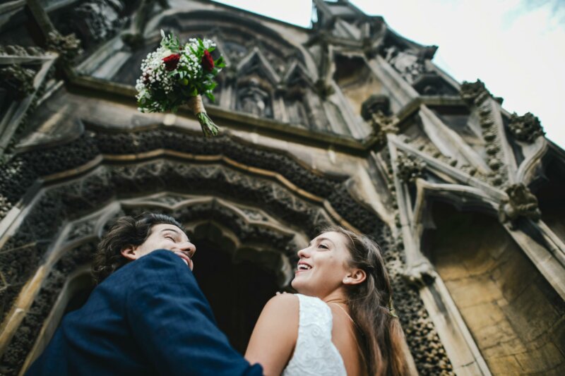 Couple looking up in front of a church