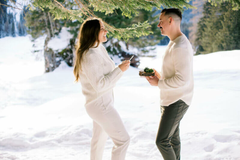 Couple exchanging vows in a snowy landscape