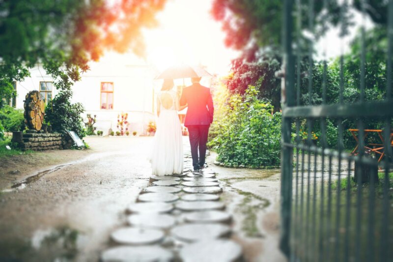 Couple walking under an umbrella