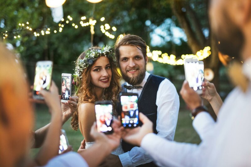Guests taking pictures at a wedding party