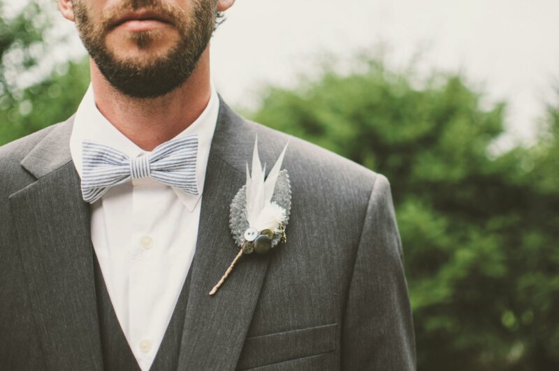 Man with boutonnière and bow