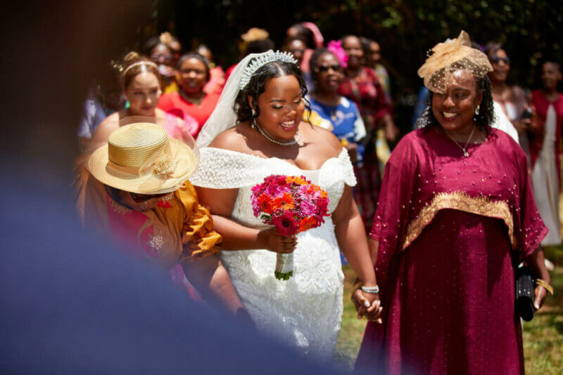 Bride walking with her mother