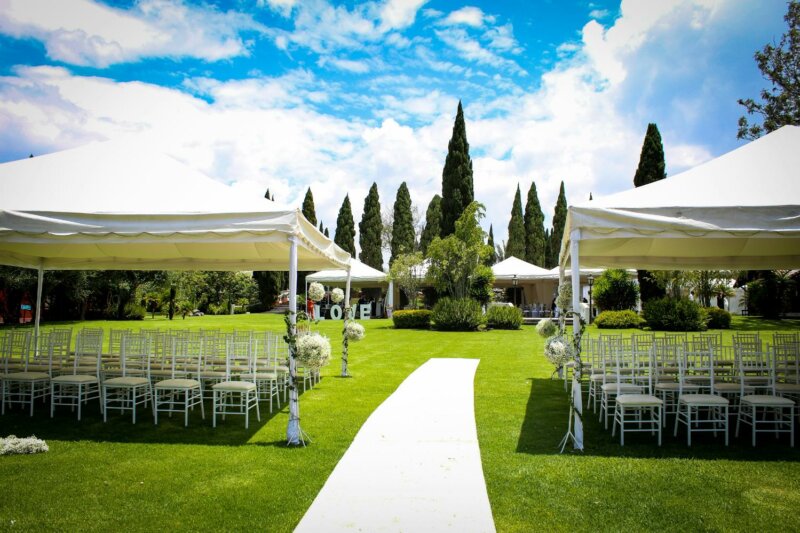 Outdoor wedding setting with marquees