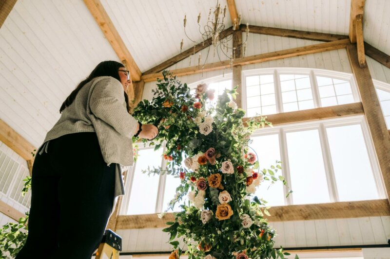 Woman hanging flowers