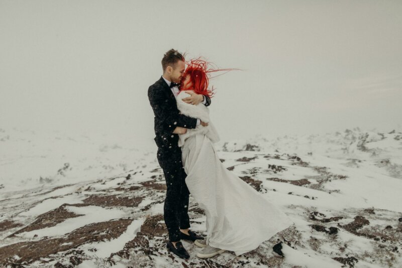 Married couple on a snowy mountain